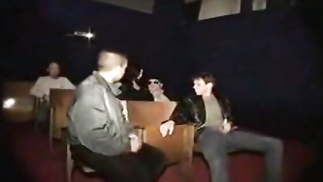 Hot group sex in dark cinema with young men in casual clothes